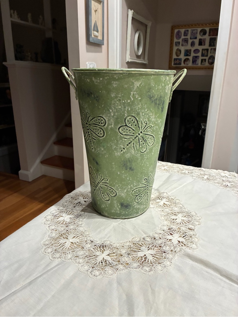 distressed green metal French bucket flower vase featuring embossed dragonfly